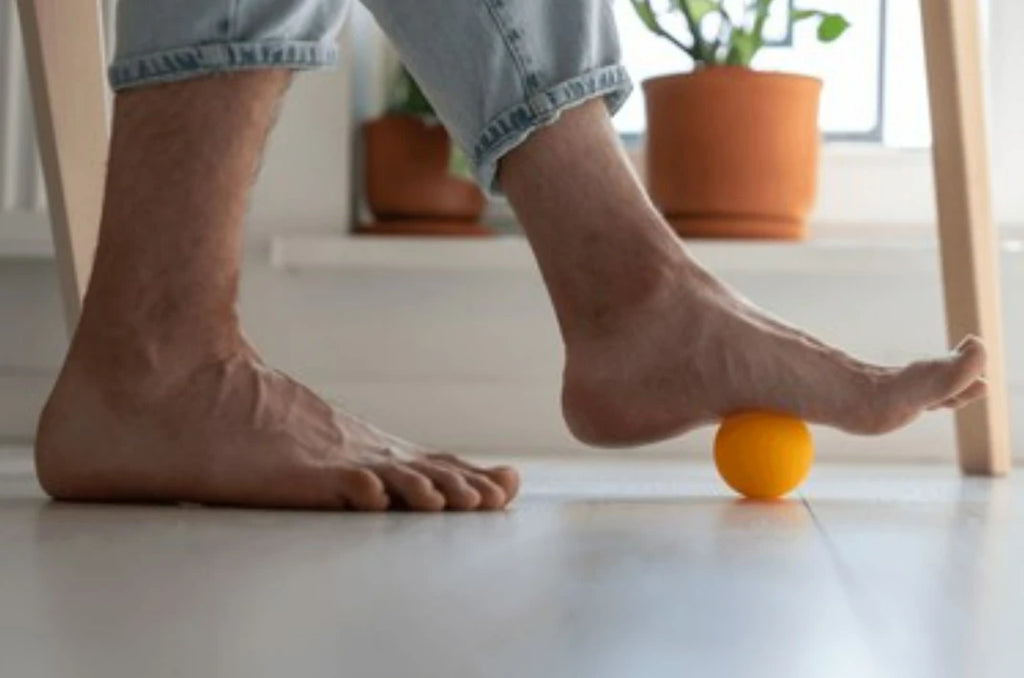 massage feet with tennis ball