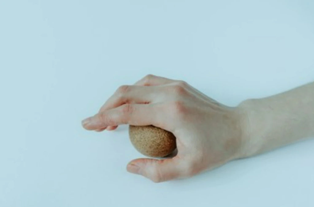 small wooden massage ball
